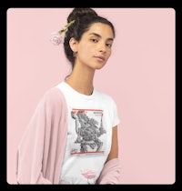 a woman wearing a white t - shirt with an image of a woman holding a rose