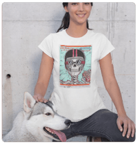 a woman wearing a t - shirt with an image of a skeleton and a dog
